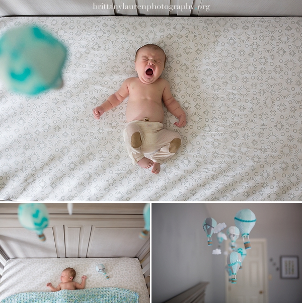 Newborn yawning in crib 